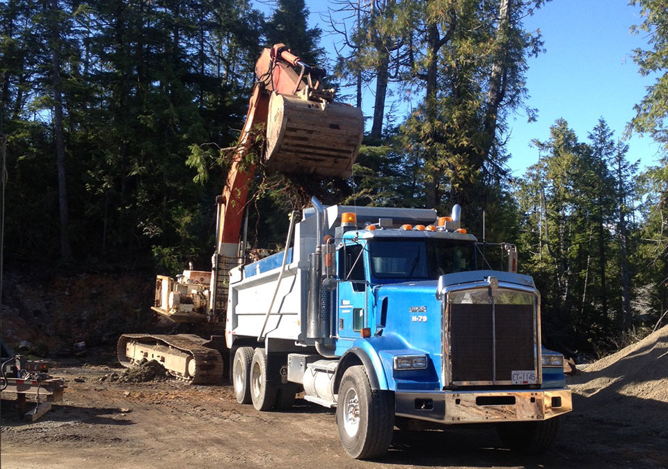 Crow Excavator Loading Tandem Dumptruck